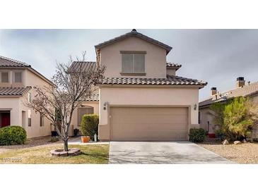 Inviting two-story home with a well-maintained front yard and a two-car garage at 4535 Sparwood Dr, Las Vegas, NV 89147