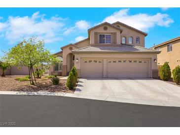Charming two-story home featuring a three-car garage and beautifully landscaped front yard with desert landscaping at 8287 Lincoln Valley St, Las Vegas, NV 89123