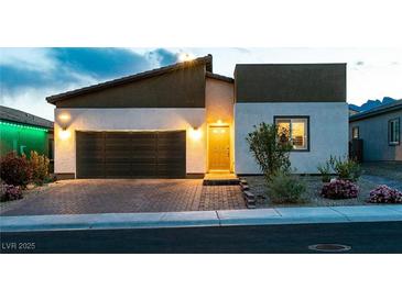 Charming single-Gathering home boasting a two-car garage and a well-manicured lawn at 10125 Sequoia Falls Pl, Las Vegas, NV 89149