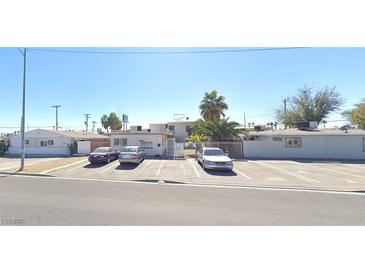 Apartment complex with off-street parking and palm trees for shade at 1832 Lewis Ave, Las Vegas, NV 89101