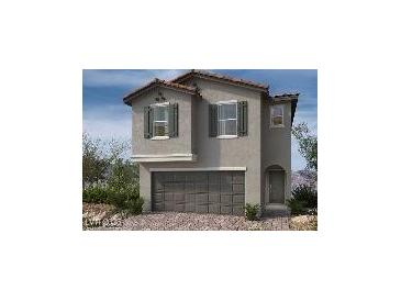 Two-story home featuring stone accents, a front-entry garage, and a welcoming covered porch at 9070 Rivington Ave, Las Vegas, NV 89148