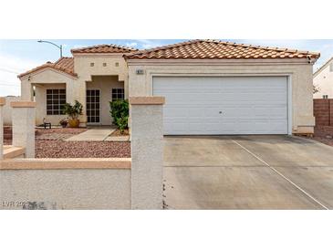Charming single-story home with a well-maintained yard and a two-car garage at 436 Pumpkin Way, Henderson, NV 89015