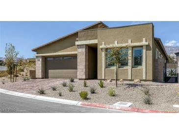 Charming single-story home with a two-car garage and desert landscaping for low maintenance at 12438 Heritage Bend Dr, Las Vegas, NV 89138
