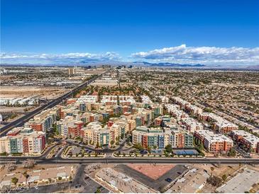 Stunning aerial view showcases the community's layout and proximity to city and mountain views at 50 E Serene Ave # 107, Las Vegas, NV 89123