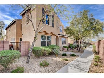 Charming two-story house featuring low-maintenance landscaping and a welcoming walkway at 11036 Mount Hunter St, Las Vegas, NV 89179