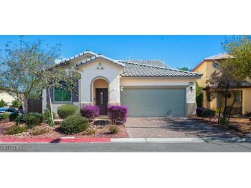 Charming single-story home with a two-car garage, landscaped front yard, and beautiful desert landscaping at 4032 Little Bay Ave, North Las Vegas, NV 89081
