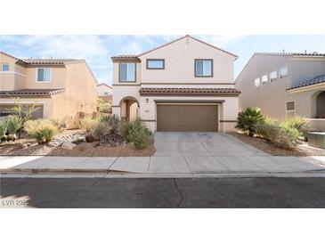 Charming two-story home featuring desert landscaping and a two-car garage at 2482 Denholme St, Henderson, NV 89044