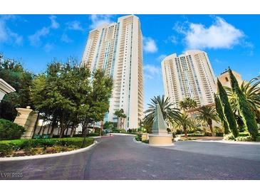 Beautiful building with tall towers, lush landscaping, and meticulously maintained paved driveways at 2747 Paradise Rd # 501, Las Vegas, NV 89109
