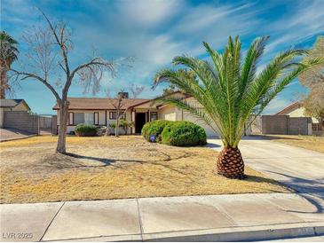 Charming single-story home featuring a well-maintained front yard and mature landscaping at 6397 Kell Ln, Las Vegas, NV 89156