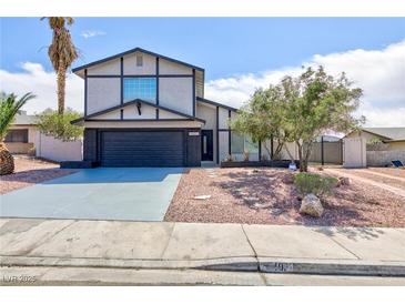 Charming two-story home featuring a well-maintained yard and a two-car garage at 6401 Goldmine Dr, Las Vegas, NV 89156