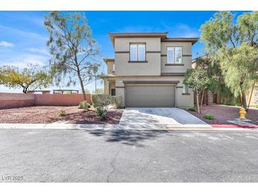 Inviting two-story home featuring a two-car garage and low-maintenance landscaping at 10529 Mount Blackburn Ave, Las Vegas, NV 89166