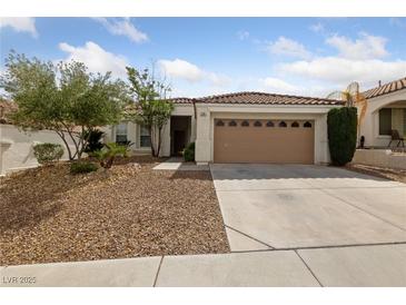 Charming single-story home featuring a well-maintained yard and a two-car garage at 274 Pear Meadow St, Henderson, NV 89012