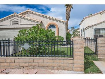 Charming single-story home with landscaped front yard and secure black metal fence at 3934 Sir Payne Ct, Las Vegas, NV 89104