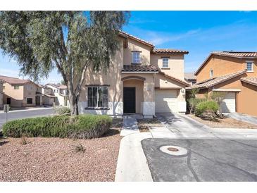 Charming two-story home with tile roof, desert landscaping, and an attached two-car garage at 5783 Sol Vista Ave, Las Vegas, NV 89122