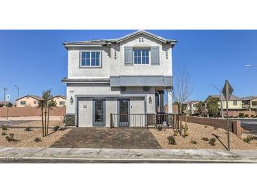 Charming two-story home boasts a welcoming entryway, modern design, and well-maintained landscaping at 8412 Sycamore Creek St, Las Vegas, NV 89113