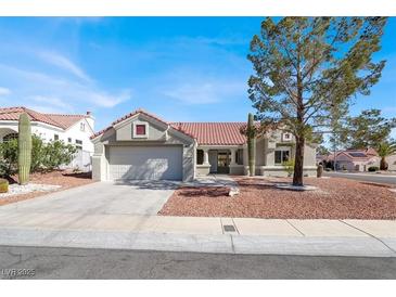Charming single story home featuring a tile roof and well maintained front yard at 8500 Gull Dr, Las Vegas, NV 89134