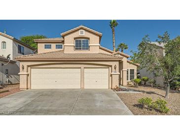 Charming two-story home with a stucco exterior, desert landscaping, and a spacious three-car garage at 8447 Amherst Valley St, Las Vegas, NV 89123