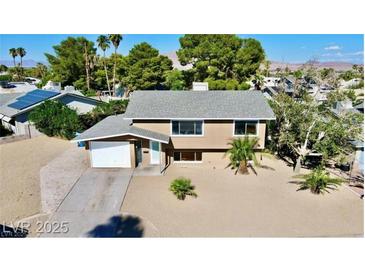 Charming two-story home with a well-maintained yard and attached garage, offering comfortable suburban living at 3950 Ventura Way, Las Vegas, NV 89121