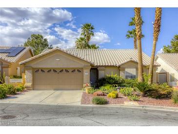 Charming single-story home with a well-manicured desert landscape and a two-car garage at 40 Trailside Ct, Henderson, NV 89012