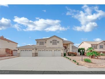 Spacious home with a large driveway and a three-car garage at 6927 Adobe Villa Ave, Las Vegas, NV 89142