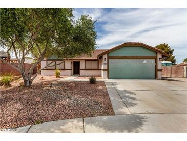 Charming single-story home featuring desert landscaping, a two-car garage, and a welcoming entrance at 1816 Mazzanti Way, Henderson, NV 89014