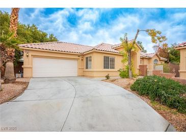 Charming single-story home featuring a two-car garage and low-maintenance desert landscaping at 2622 Rimpacific Cir, Las Vegas, NV 89146