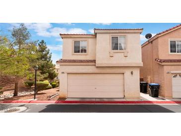 Inviting two-story home with a two-car garage and well-maintained landscaping at 3103 Sunrise Cove Ave, North Las Vegas, NV 89031
