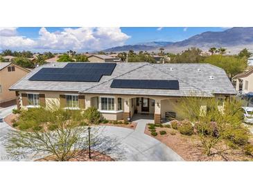 Charming single-story home featuring desert landscaping and solar panels at 5892 Castleberry Peak Ave, Las Vegas, NV 89131