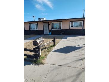 Charming single-story home with a well-maintained front yard and inviting entrance at 609 Marcella Ave, North Las Vegas, NV 89030