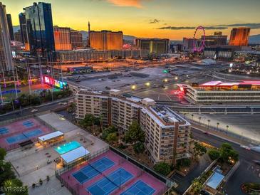Las Vegas condo with pool, tennis courts, and beautiful cityscape views at sunset at 205 E Harmon Ave # 803, Las Vegas, NV 89169