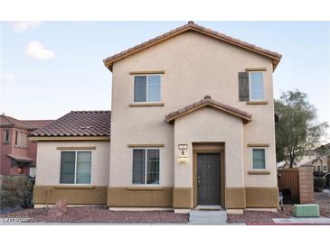 Charming two-story home with a well-maintained stucco exterior and inviting front entrance at 649 Ryan Peak Ln, Henderson, NV 89011