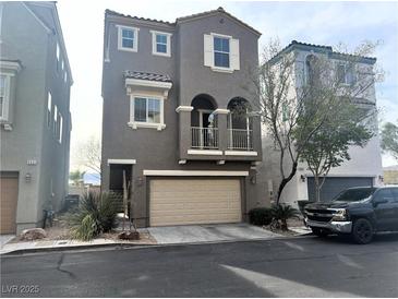 Attractive two-story home features a balcony, a two-car garage, and desert landscaping at 9535 Leaping Lizard St, Las Vegas, NV 89178