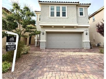 Charming two-story home with a two-car garage and a beautifully paved driveway at 2922 Tranquil Brook Ave, Henderson, NV 89044