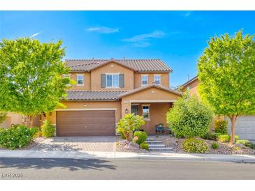Charming two-story home featuring desert landscaping and a tile roof at 689 Silver Pearl St, Henderson, NV 89002