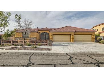 Charming single-story home featuring a three-car garage and well-maintained front yard in a suburban setting at 7568 Shadow Estates Way, Las Vegas, NV 89113