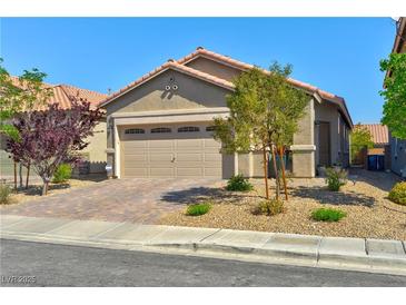 Charming single-story home with a two-car garage and well-maintained desert landscaping at 8036 Literature Ct, Las Vegas, NV 89113