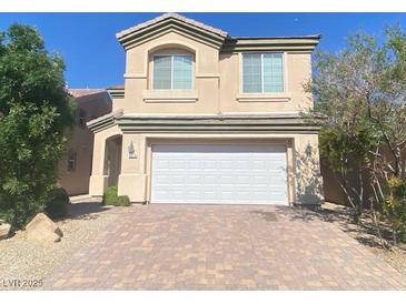 Charming two-story home featuring a large two car garage and inviting front entrance at 8374 Pioneer Way, Las Vegas, NV 89113