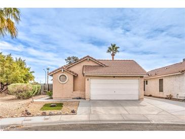 Charming single-story home featuring a 2-car garage and a well-maintained front yard landscape at 2744 Ironside Dr, Las Vegas, NV 89108