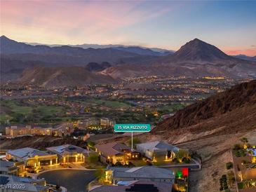 Stunning aerial view of a luxury home showcasing mountain views in the upscale community at 35 Via Rizzuto, Henderson, NV 89011