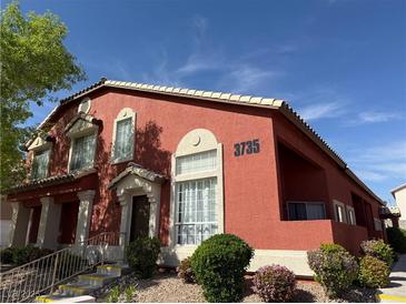 Charming two-story home with terracotta exterior paint, landscaped yard, and elegant architectural details at 3735 Sand Pier St, Las Vegas, NV 89147