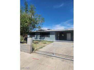 Charming single story home features a landscaped yard and a concrete driveway at 4536 Payson Ave, Las Vegas, NV 89115