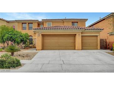 Spacious home featuring a three-car garage with a beautiful terracotta-colored tile roof at 7216 Campolina Ct, Las Vegas, NV 89113
