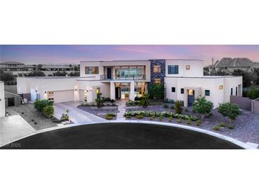 Contemporary home featuring a manicured front yard and a multi-car garage at 9780 Solar Ave, Las Vegas, NV 89149