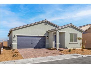Charming single-story home featuring a two-car garage and a well-maintained front yard with drought resistant landscaping at 2721 Avril Point St, Las Vegas, NV 89156