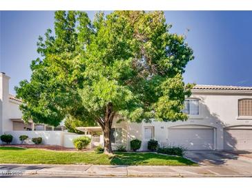 Charming two-story home with mature trees in a well-maintained yard at 447 Temple Canyon Pl, Henderson, NV 89074