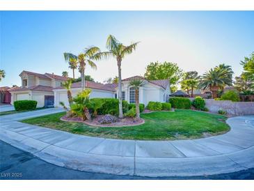Charming single-story home boasting a lush lawn, mature landscaping, and delightful curb appeal at 4517 Inez Dr, Las Vegas, NV 89130