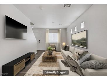 Bright living room features neutral tones, modern decor, and a cozy atmosphere at 5135 Paradise Valley Ave, Las Vegas, NV 89156