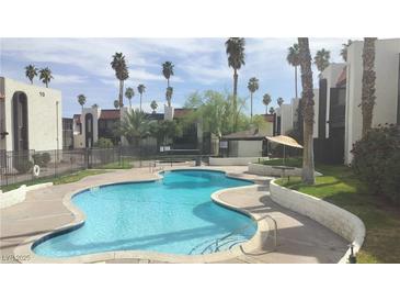 Inviting community pool featuring clean, cool water and meticulously maintained surrounding grounds and landscaping at 1405 Vegas Valley Dr # 114, Las Vegas, NV 89169