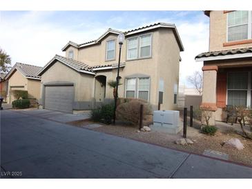 Charming two-story home with a well-maintained front yard and a two-car garage at 2520 Living Rock St, Las Vegas, NV 89106