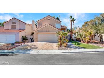 Charming home featuring a two-car garage and desert landscaping at 3257 Coral Harbor Dr, Las Vegas, NV 89117